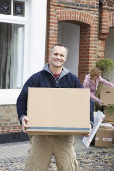 Man with a van loading furniture in St Johns Wood
