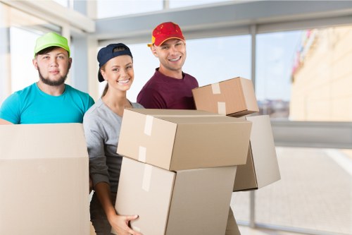 Crew handling a furniture move with care and safety measures