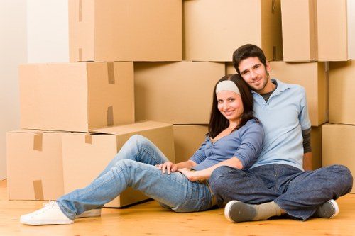 Packed household boxes and furniture ready for loading