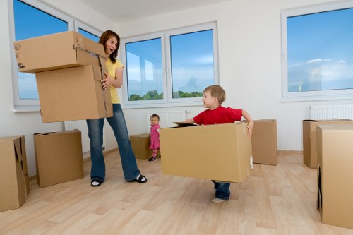 Local moving team transporting furniture in St Johns Wood